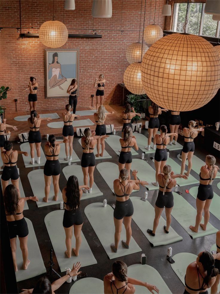 A class moving together in a bright studio